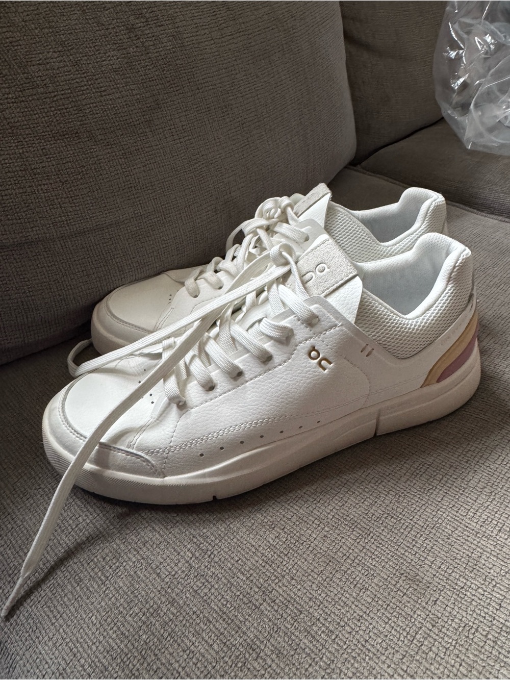 On Running White Sneakers with Gold and Pale Pink Accents